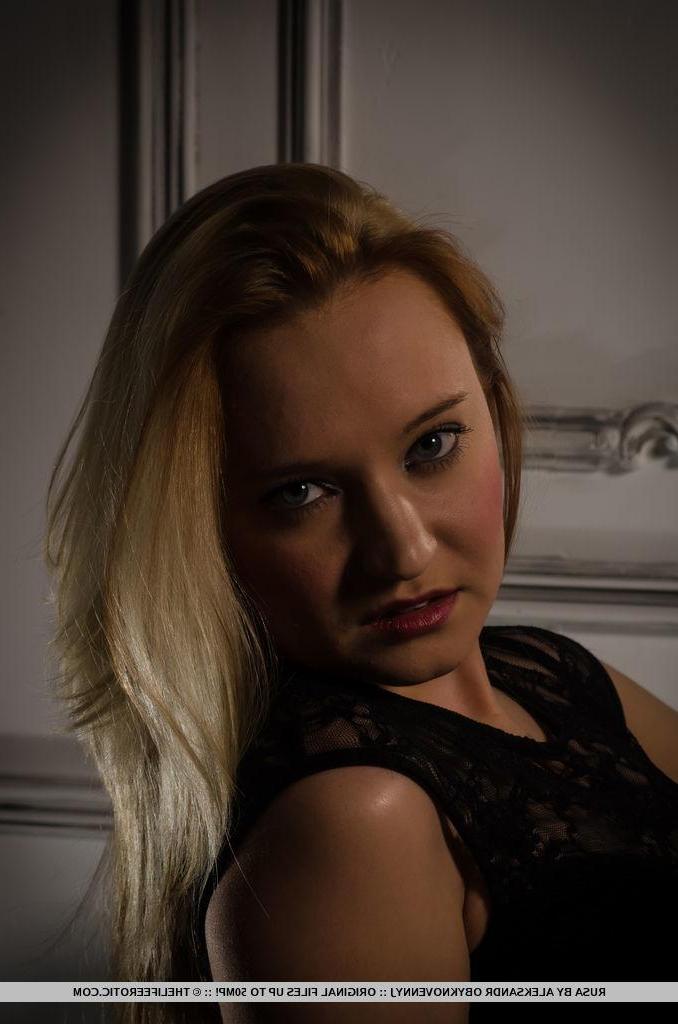 16P Erotic model Rusa lifts her black dress to fondle her wet pussy