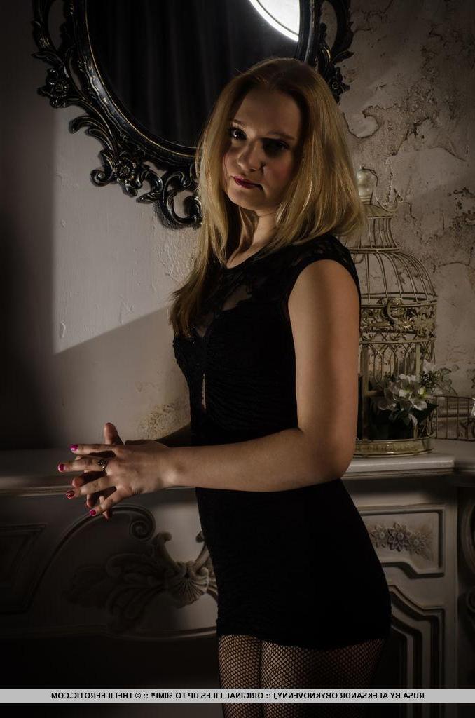 16P Erotic model Rusa lifts her black dress to fondle her wet pussy