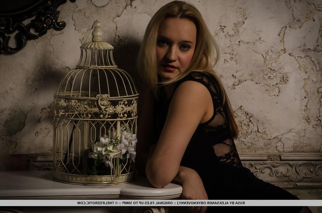 16P Erotic model Rusa lifts her black dress to fondle her wet pussy