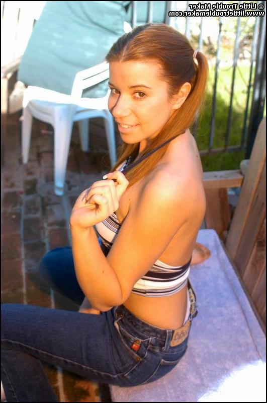 20P Pictures of teen Little Troublemaker exposing her tits in the back yard