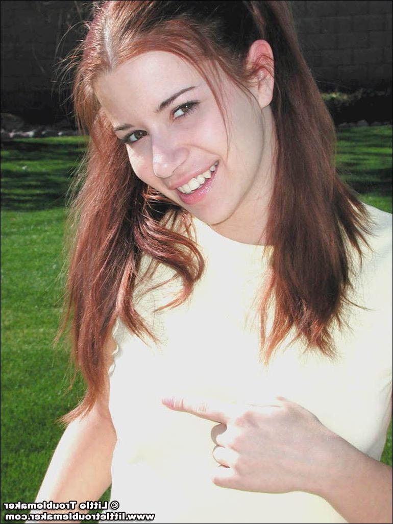 20P Pictures of teen slut Little Troublemaker stripping in the back yard