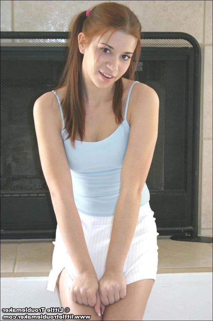 20P Pictures of teen hottie Little Troublemaker taking off her top