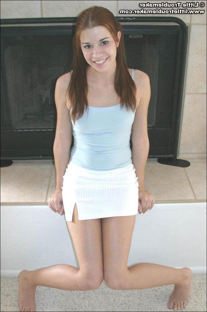 20P Pictures of teen hottie Little Troublemaker taking off her top