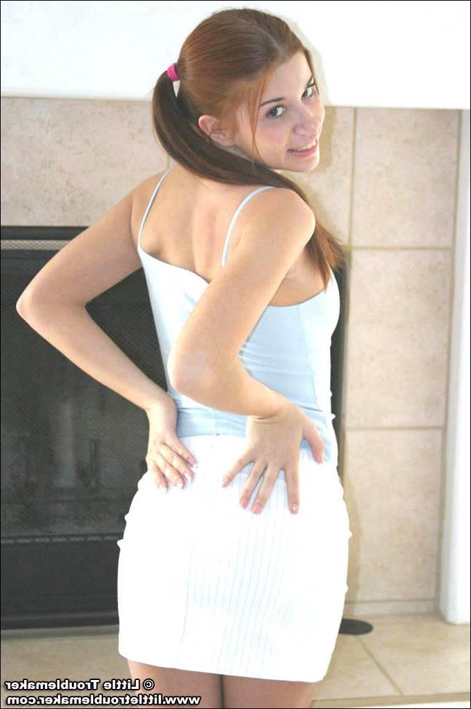 20P Pictures of teen hottie Little Troublemaker taking off her top