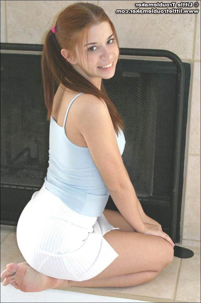 20P Pictures of teen hottie Little Troublemaker taking off her top