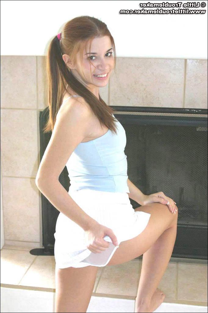 20P Pictures of teen hottie Little Troublemaker taking off her top