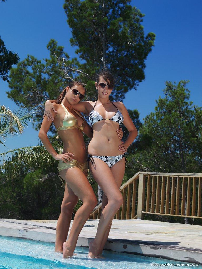 16P Two stunning luscious babes, drenched and wet but still smolderingly sexy, strips their ultra-sexy bikini and raising the temperature further with their artistically provocative poses.