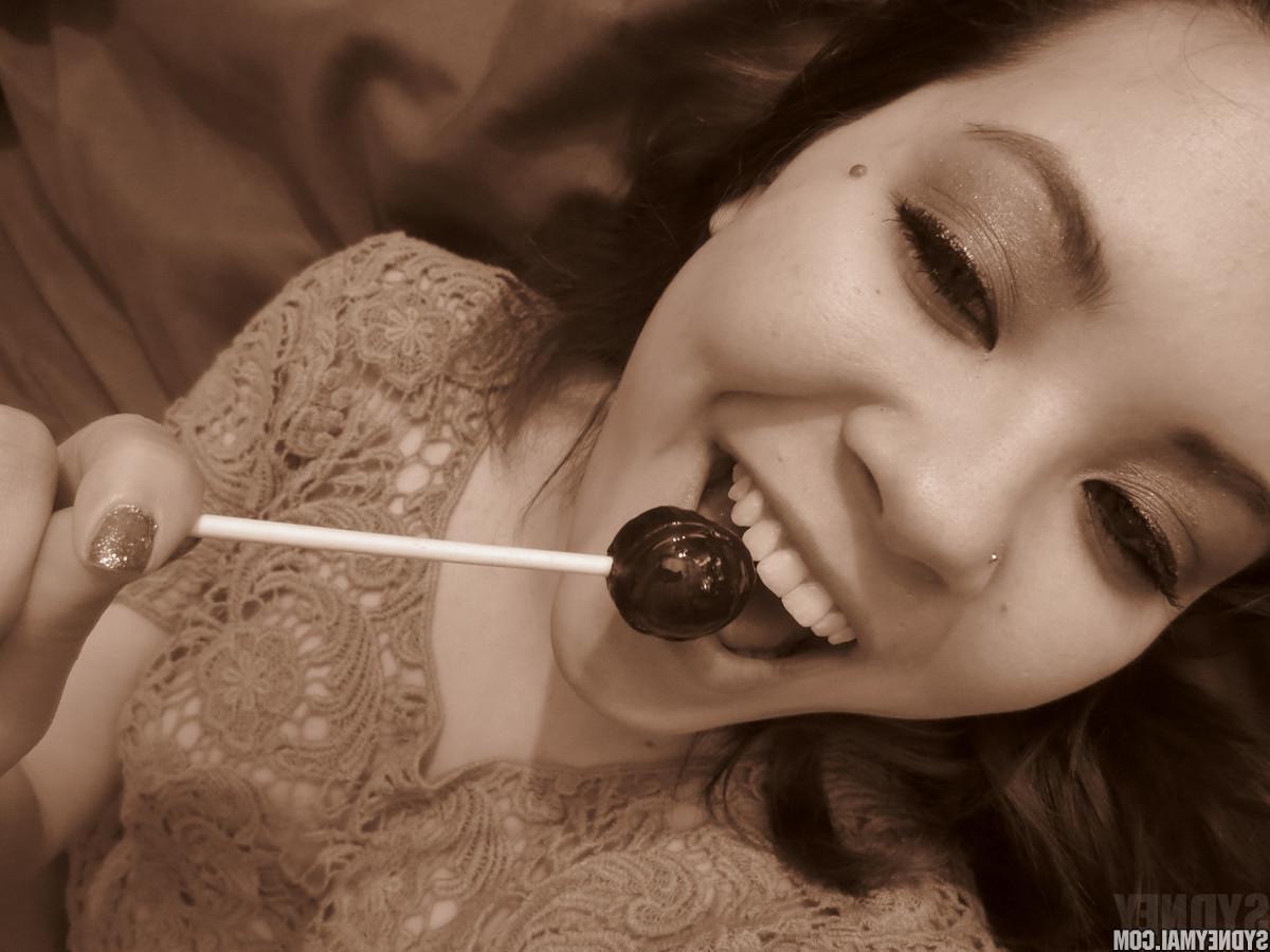 15P Beautiful asian girl Sydney Mai teaess with a lollipop