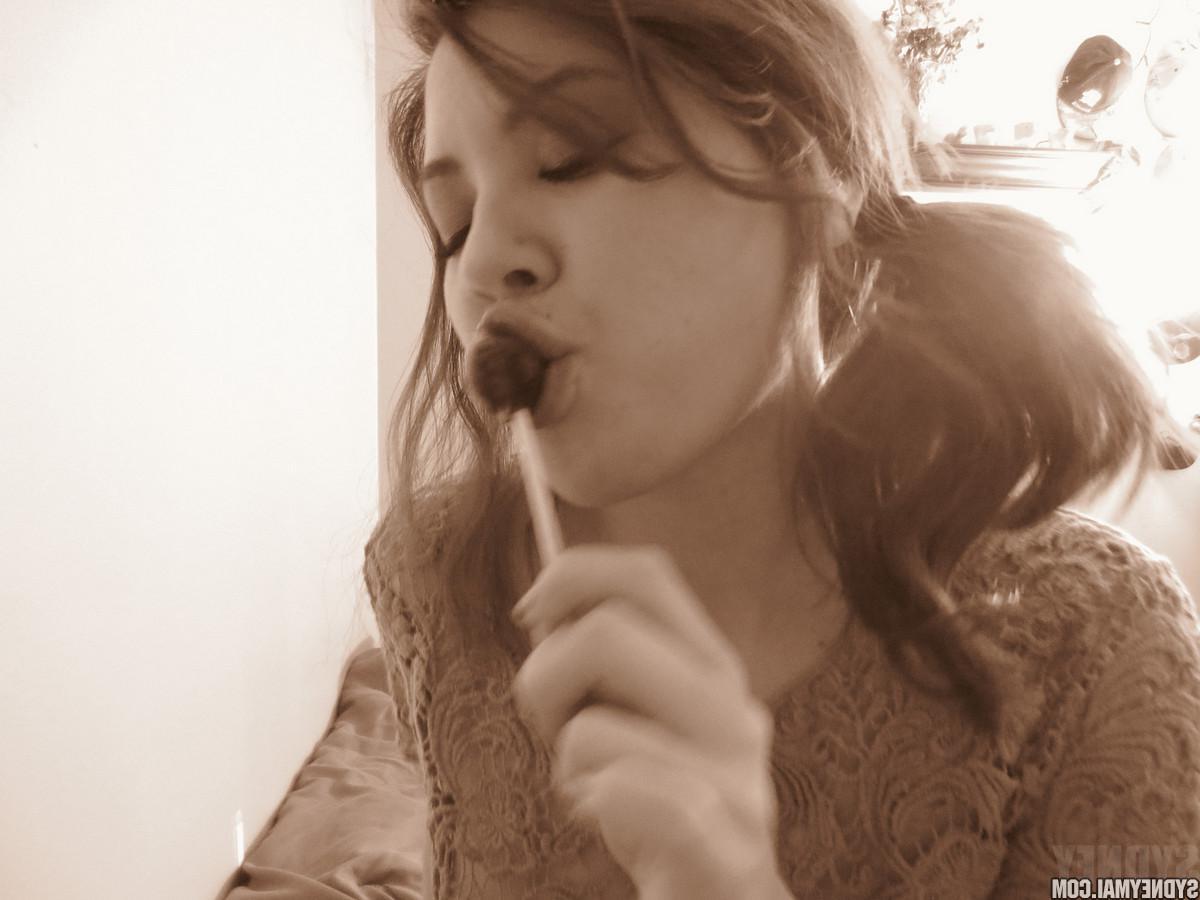 15P Beautiful asian girl Sydney Mai teaess with a lollipop