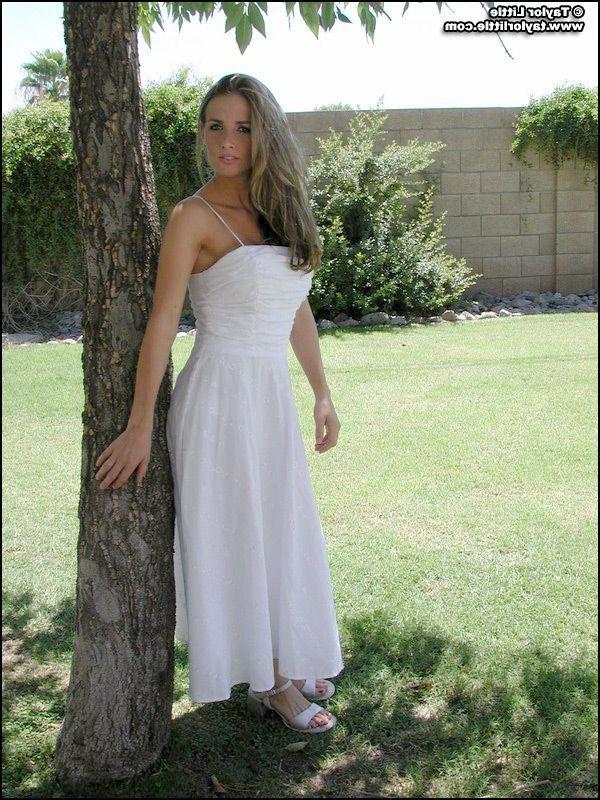 20P Pictures of teen hottie Taylor Little stripping by a tree