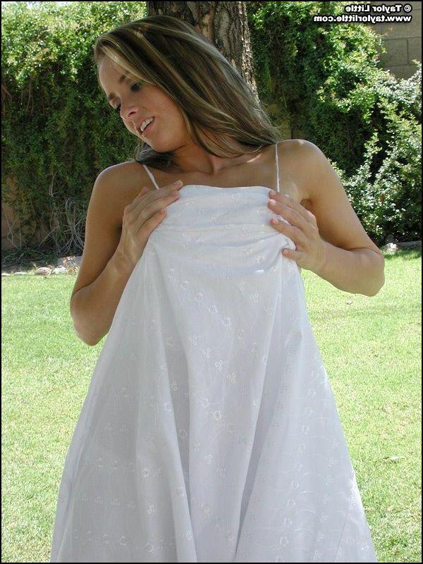 20P Pictures of teen hottie Taylor Little stripping by a tree