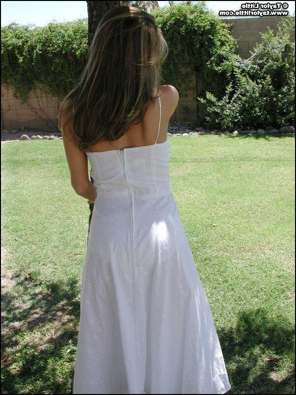 20P Pictures of teen hottie Taylor Little stripping by a tree