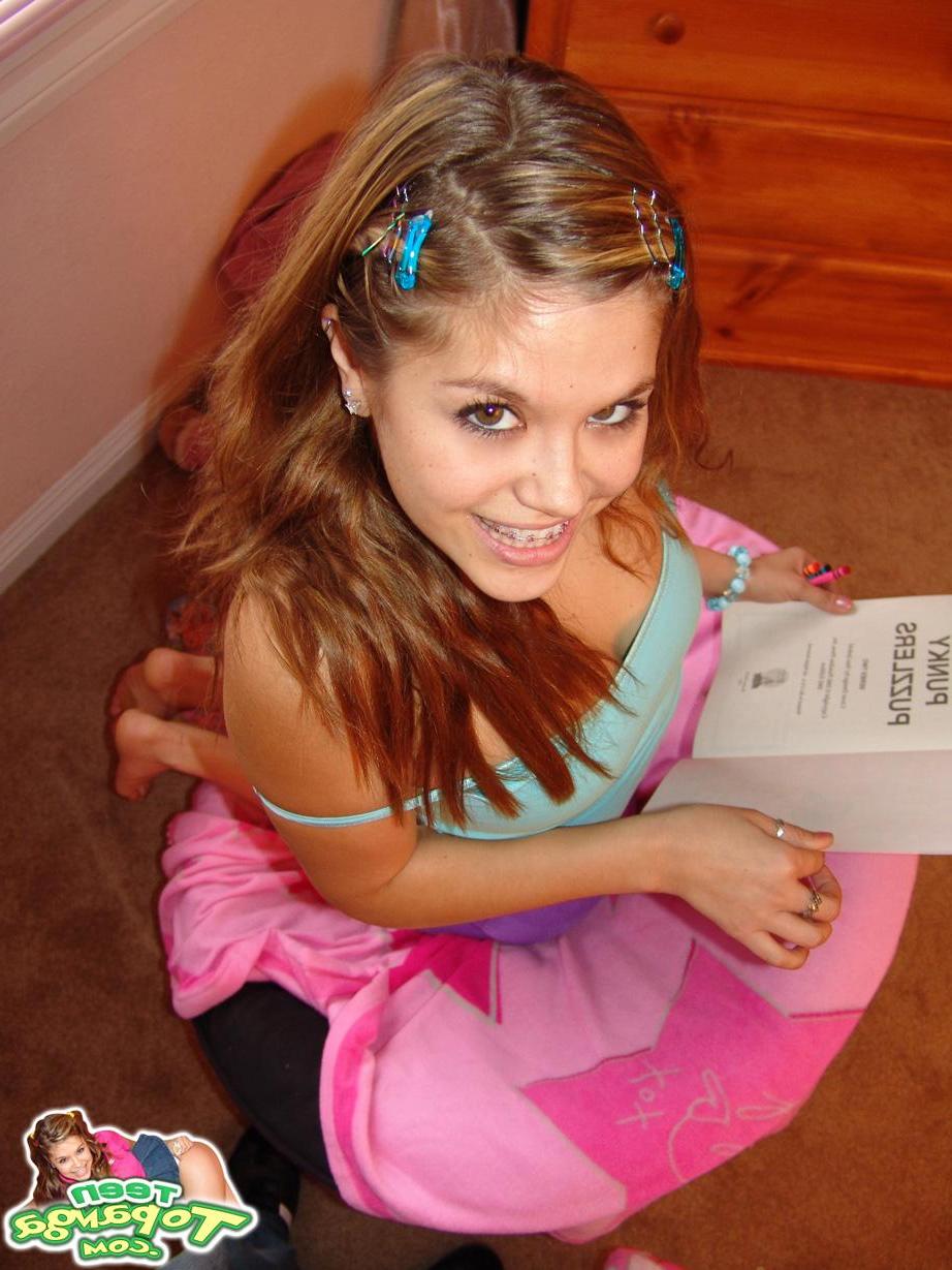 18P Teen Topanga slides off her panties and flashes her tits