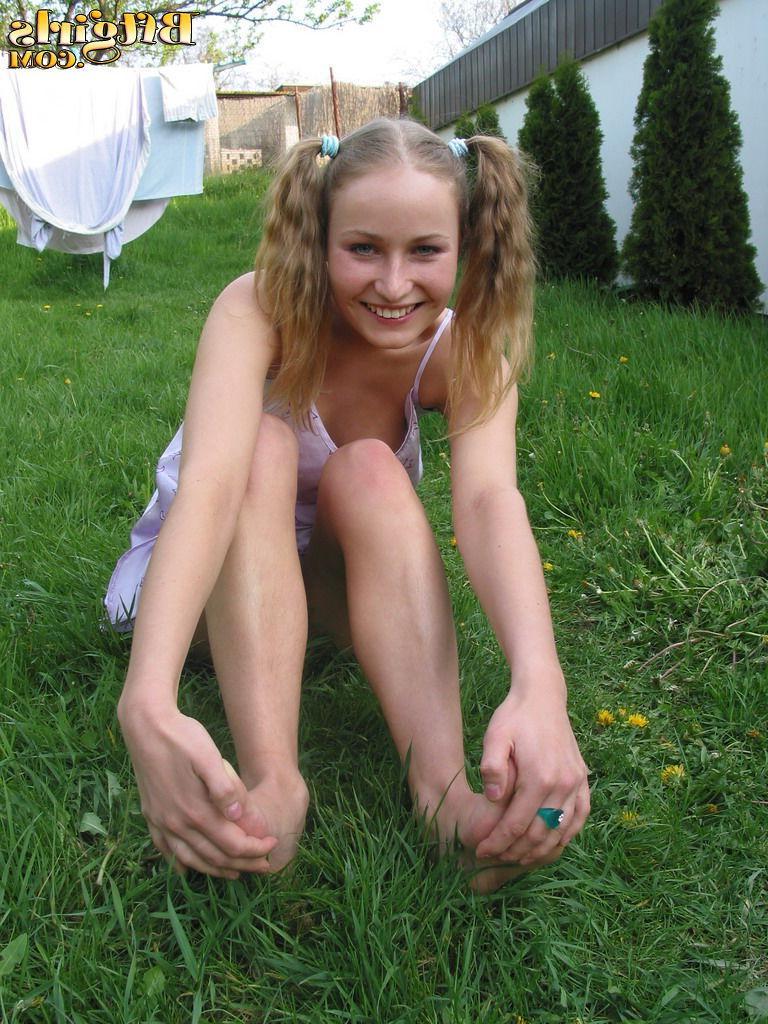 15P Sexy blonde teen sucks her toes on the grass