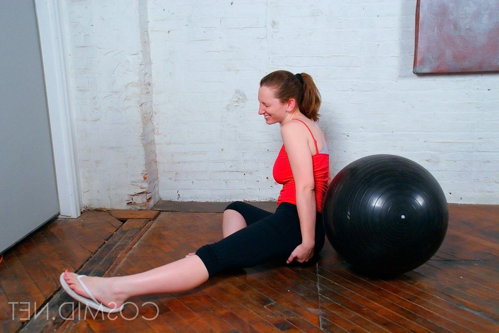 16P Pictures of a busty topless amateur doing yoga