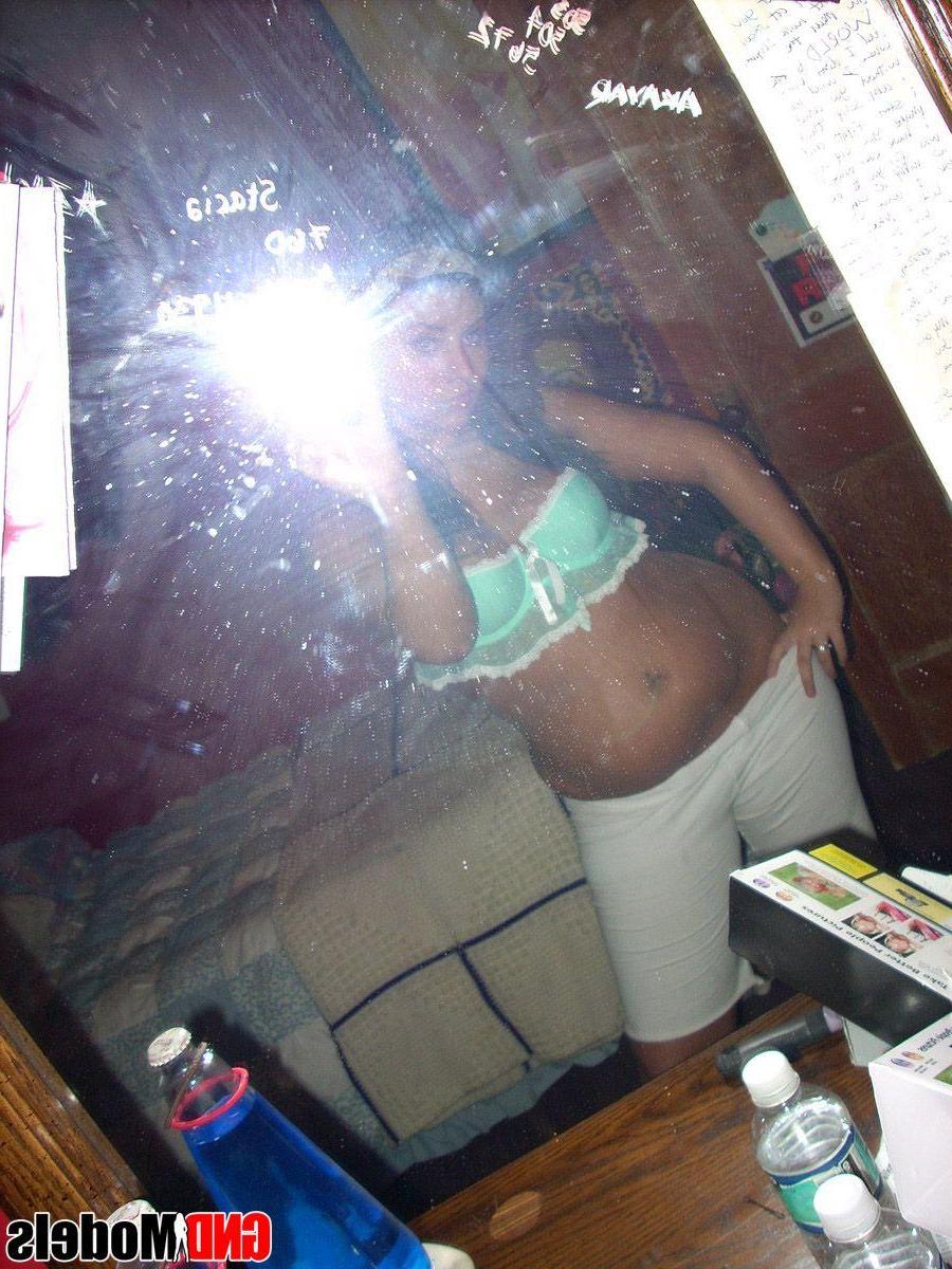 12P Pictures of a sexy brunette girl taking pics of herself