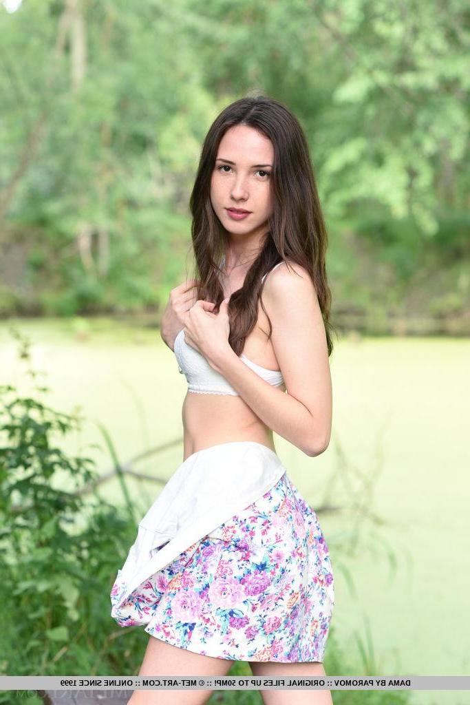 18P Brunette beauty Dama reveals her hot nude body in the woods