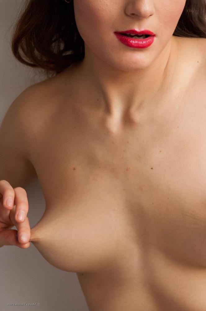 10P Brunette model Carol J shows you her nude body in bed