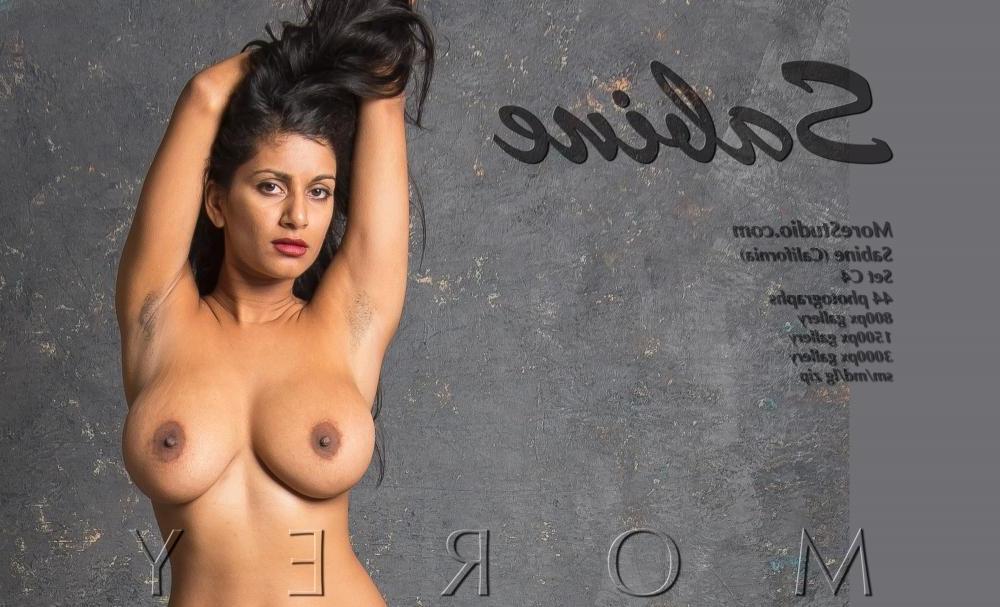 11P Busty babe Sabine shows off her curvy body in the studio