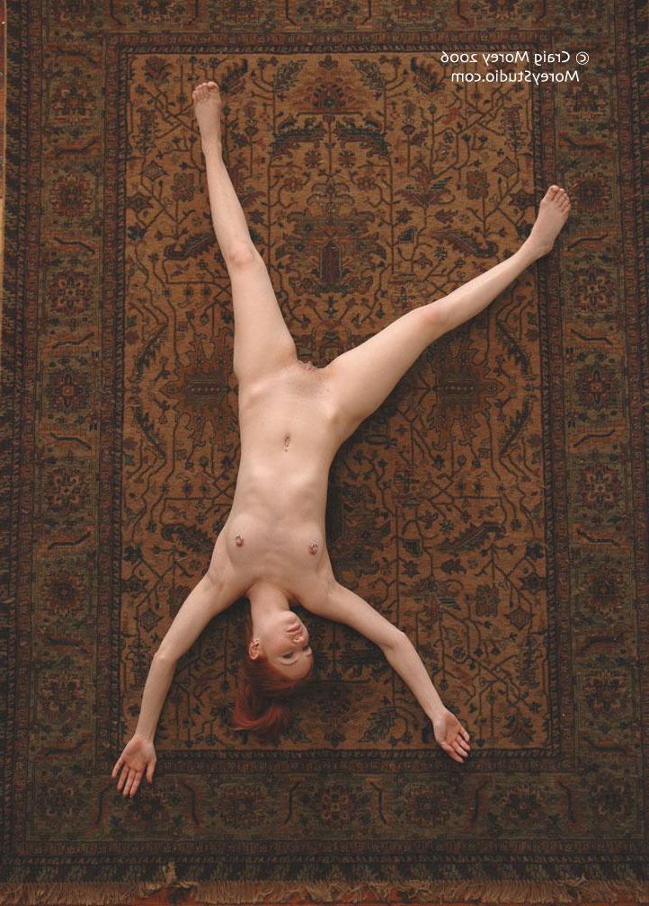 12P Redhead babe Calico shows off her nude body in a variety of poses