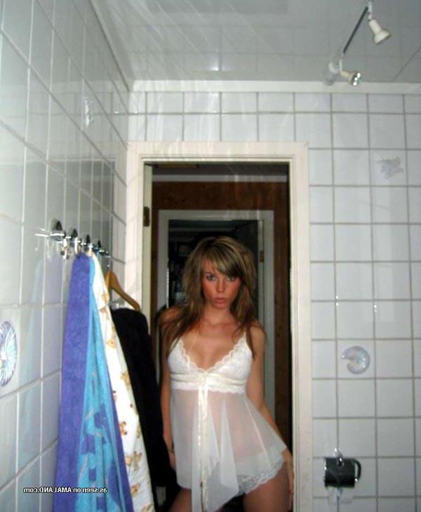 15P Hot chick flaunting her body in a sexy white nightgown
