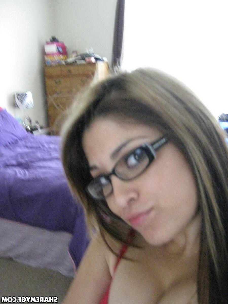 20P Hot coed in glasses takes selfies of her hot body in the bedroom