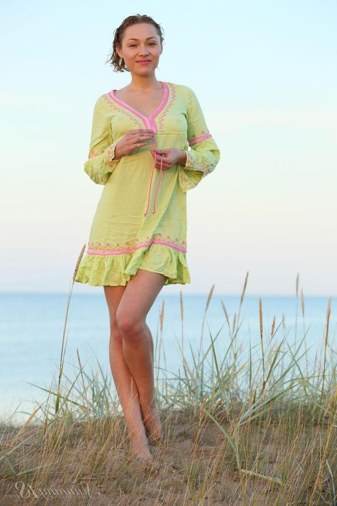 16P Sarah strips out of her dress by the ocean