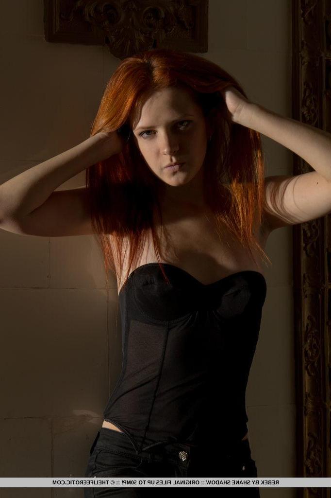 16P Redhead model Rebek slides down her pants to finger her wet pussy