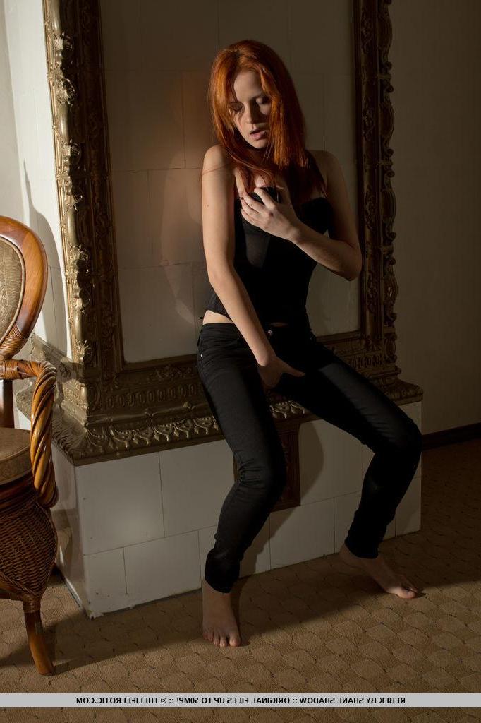 16P Redhead model Rebek slides down her pants to finger her wet pussy