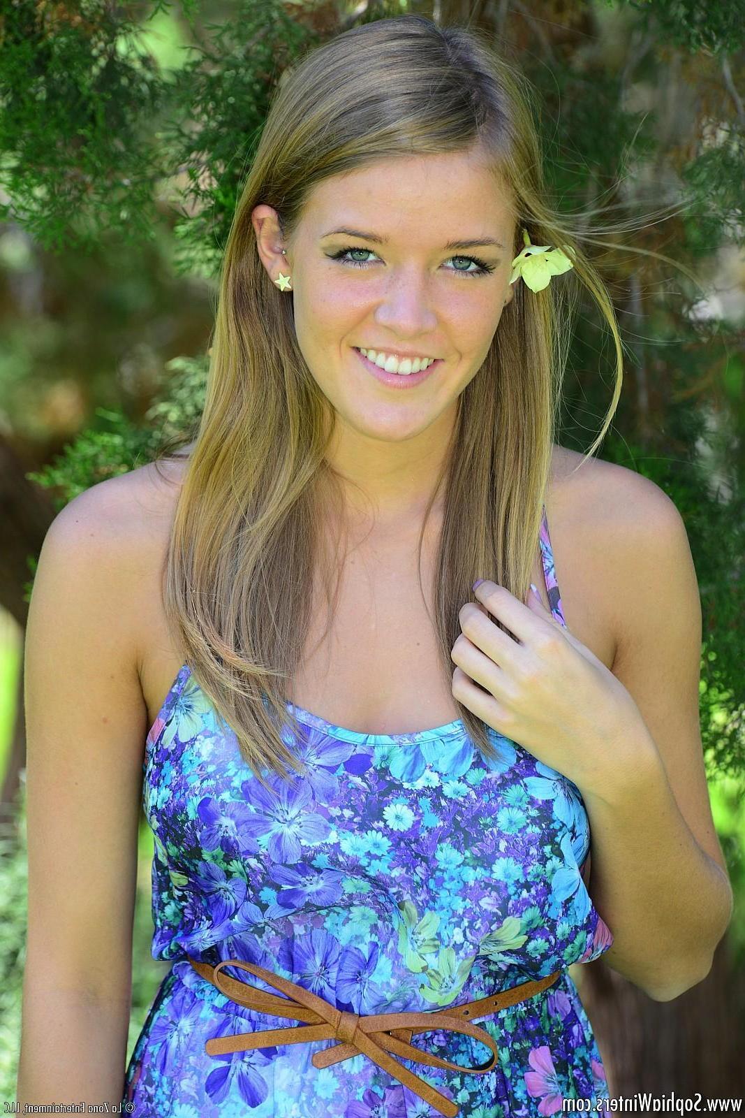 15P Sophia Winters wears a light summer dress and she lays in the grass and orgasms with her toy