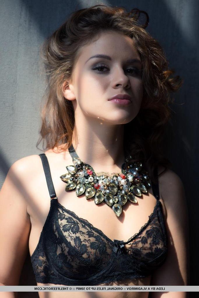 16P Redhead model Leda fondles herself in high heels and lingerie