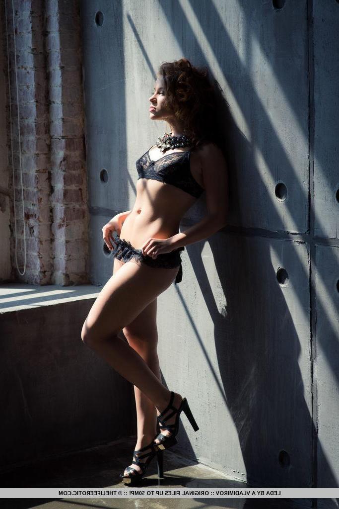16P Redhead model Leda fondles herself in high heels and lingerie