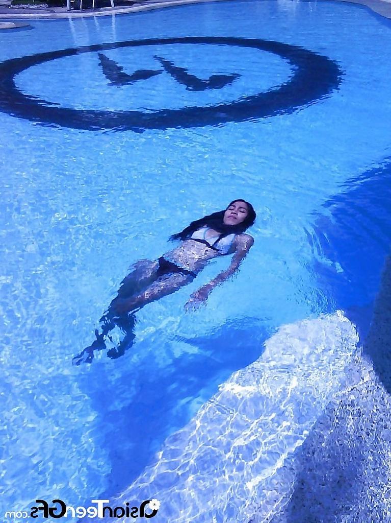 10P Nice young asian chick swimming in pool