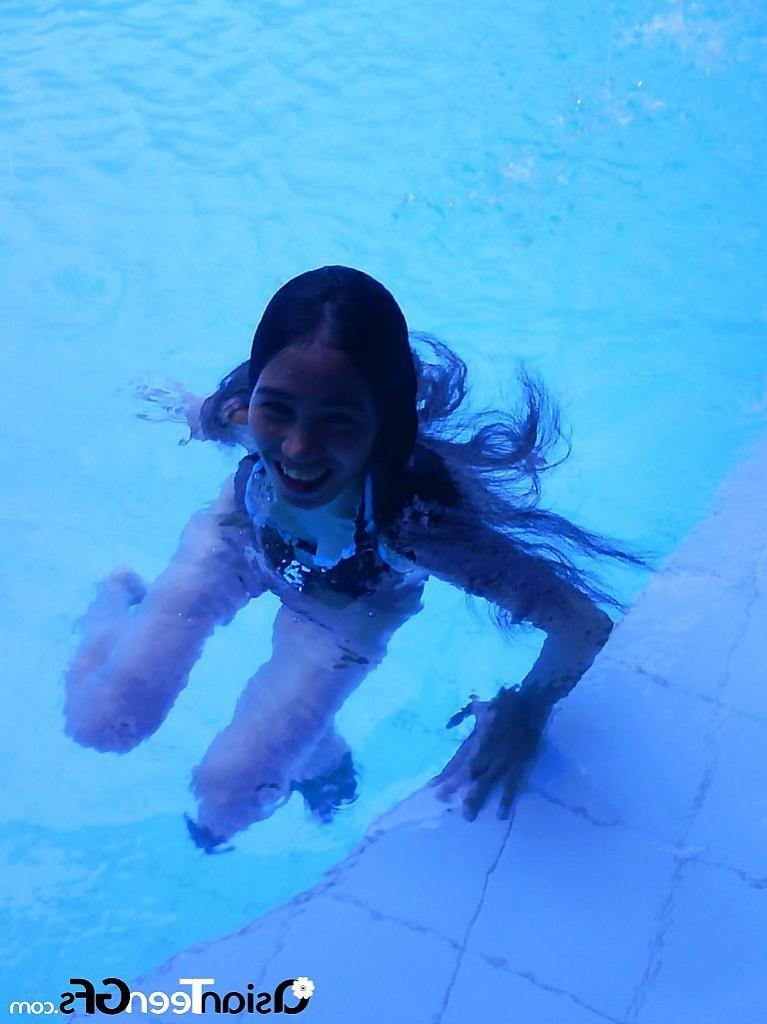 10P Nice young asian chick swimming in pool