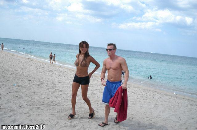 12P Busty beach milf does a hot striptease before sucking on her knees