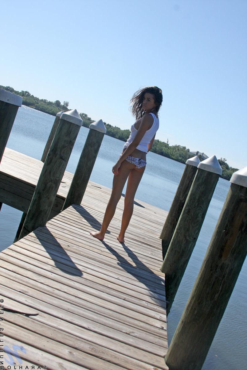 10P Stunning teen begins to undress on the boat dock