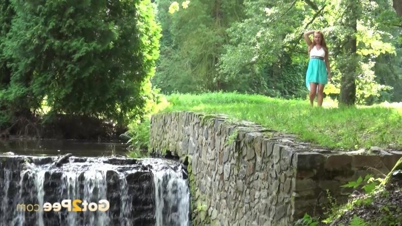 15P Girl lifts her dress and pees into a river