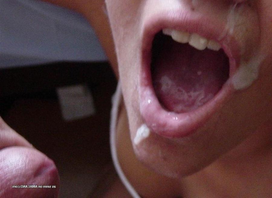 10P Photos of a naughty amateur chick loving the taste of cum