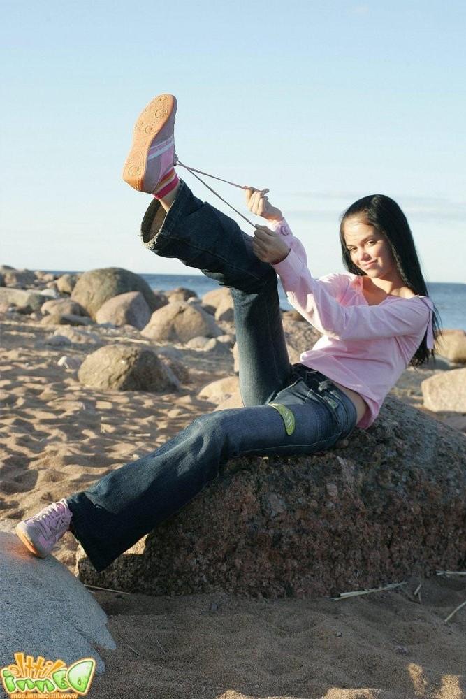 15P Petite teen Danni posing in skimpy swimsuit