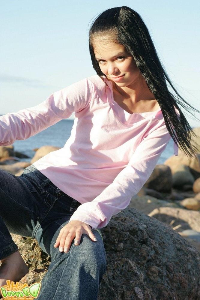 15P Petite teen Danni posing in skimpy swimsuit