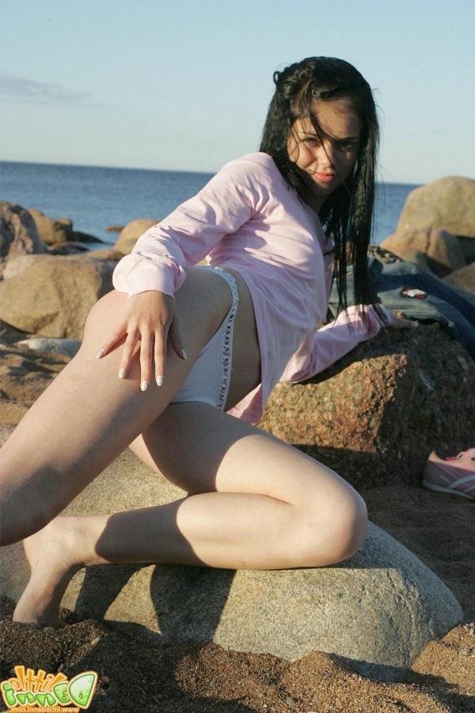 15P Petite teen Danni posing in skimpy swimsuit