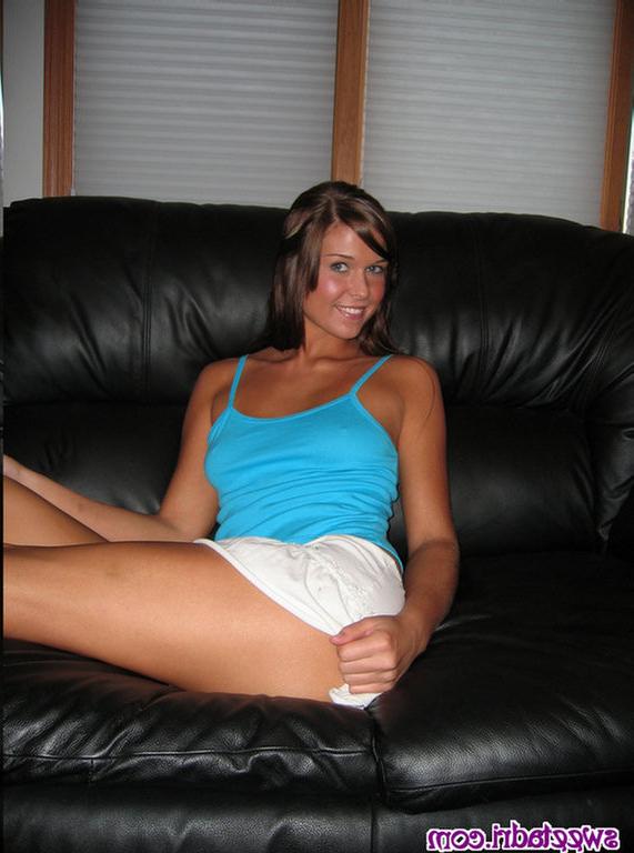 16P SweetAdri on the couch with a blue top and white skirt