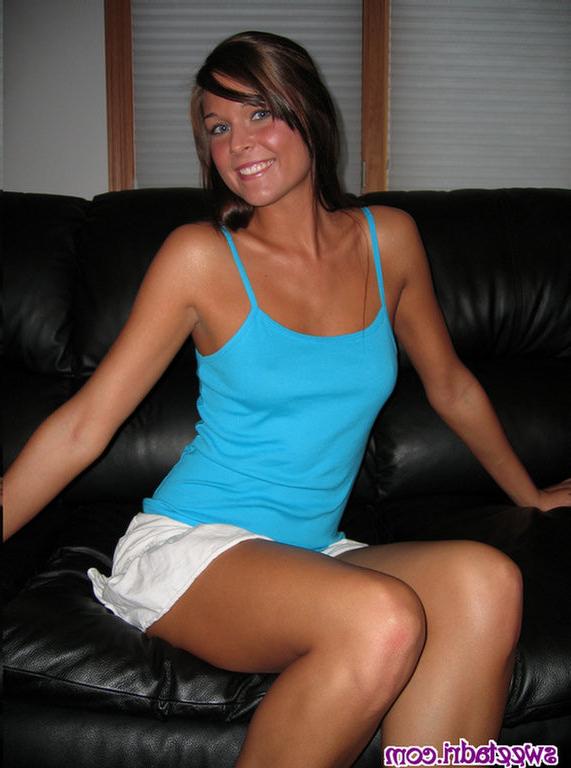 16P SweetAdri on the couch with a blue top and white skirt