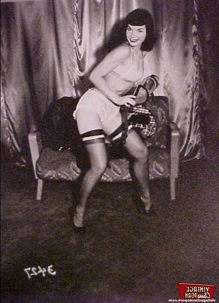 12P Betty Page loves to dance in stockings in a sensual way