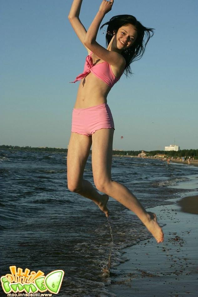 15P Small breasted teen strips in sexy pink swimsuit