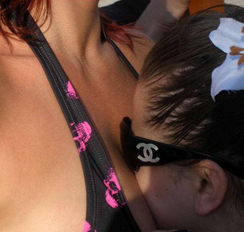 15P Pictures of an Oriental tease posing sexy in a party