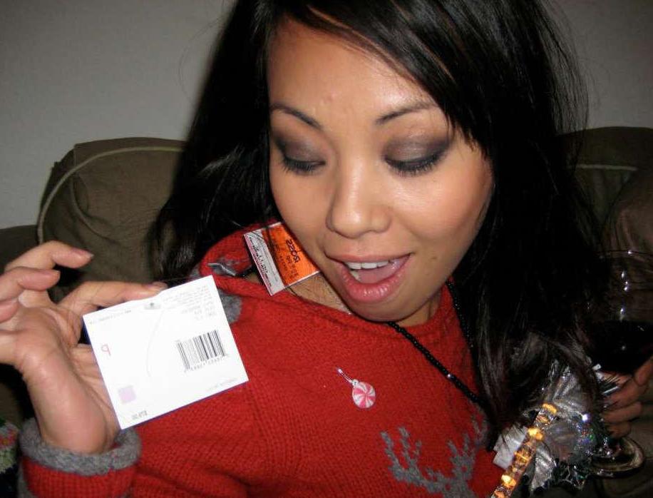 15P Pictures of an Oriental tease posing sexy in a party