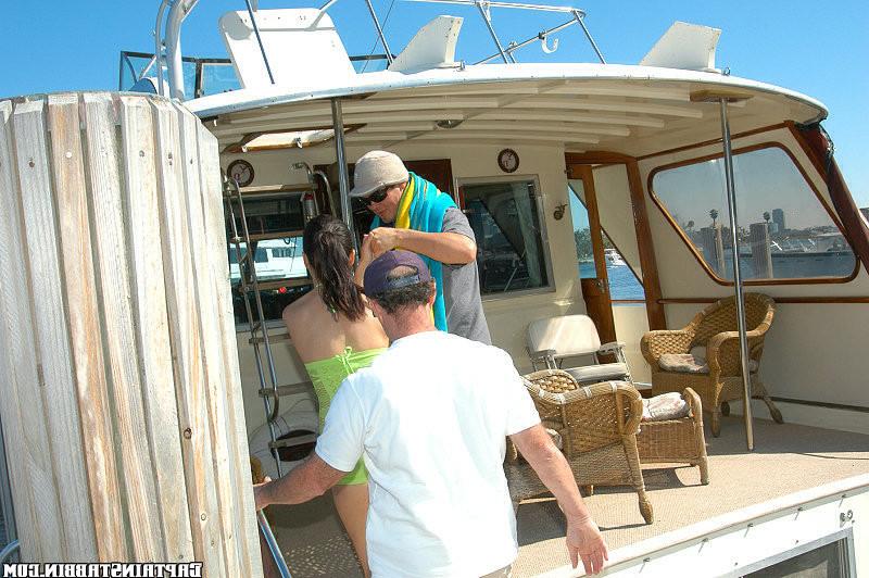 15P Cute brunnette gets dowsed with cum and then thrown off the boat in these pics