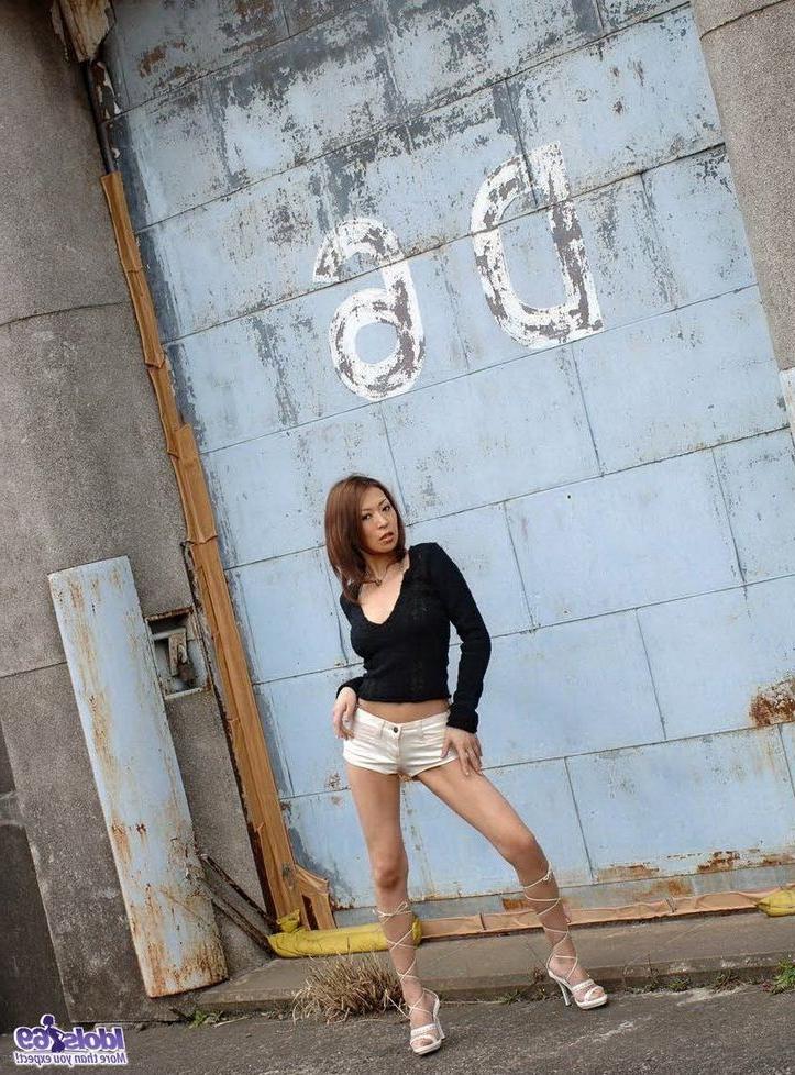 15P Cute japanese babe June poses in corset shows tits