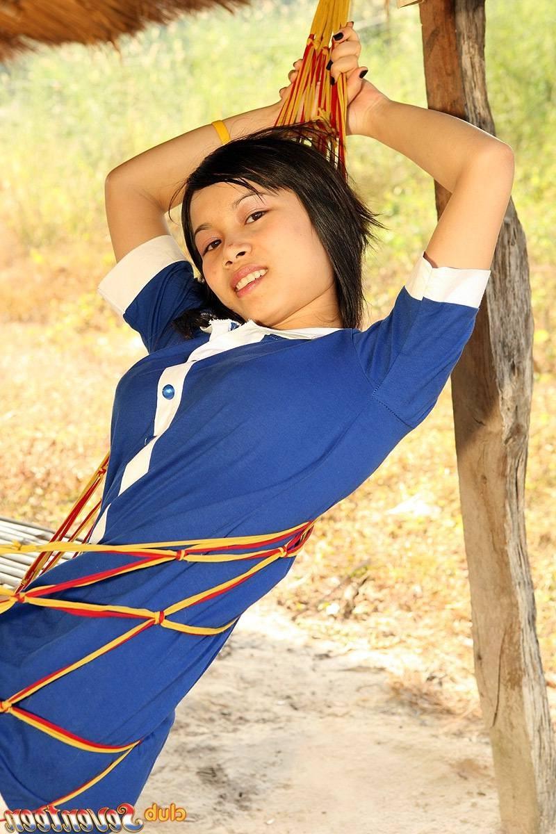 15P Young Asian cutie showing her sensual curves